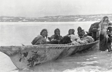 Copper Inuit people in umiak at Port Epworth, circa 1915. Creative Commons