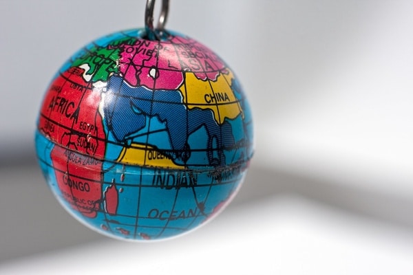 Old key chain in th shape of a small Earth Globe