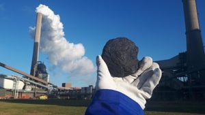 Photo: Piece of coal in front of a coal firing power plant by Adrem68 is licensed under CC BY-SA 4.0